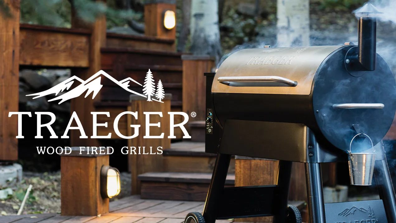 Text left - Traeger logo - Image right - A smokey Traeger grill sitting outside
