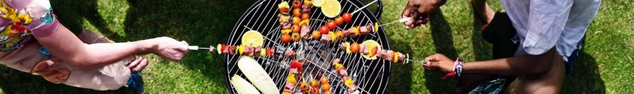 People Grilling Over a Grill
