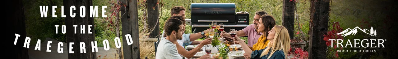 Welcome to The Traegerhood - Two couples cheering their cups over dinner on a balcony