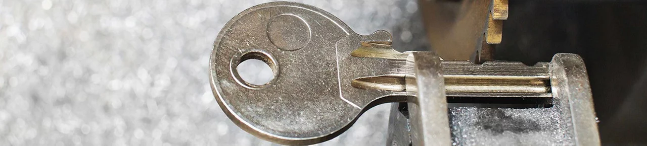 A key being cut on a key cutting machine