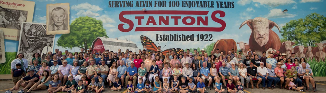 Stanton family in front of building mural