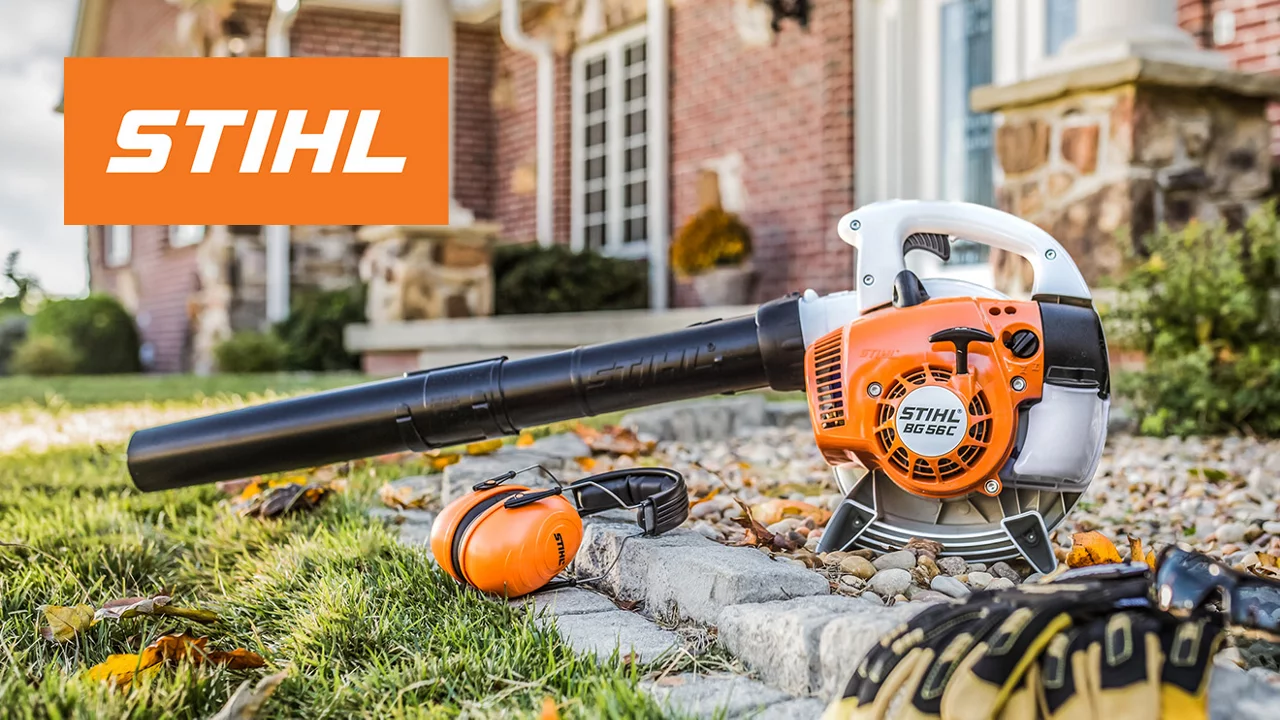 STIHL lifestyle image of a gas blower sitting in stone landscaping with STIHL logo in top left corner