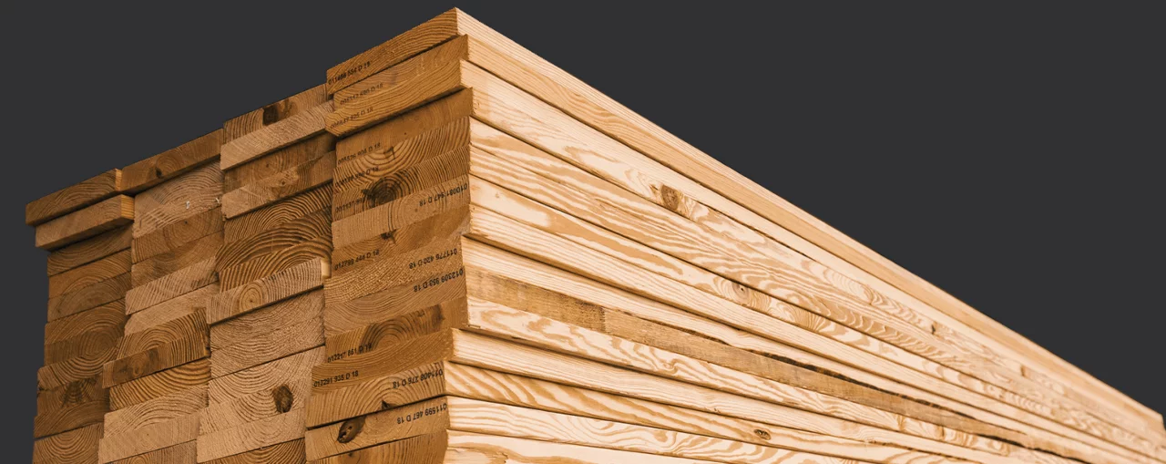 stacked lumber in a lumber yard