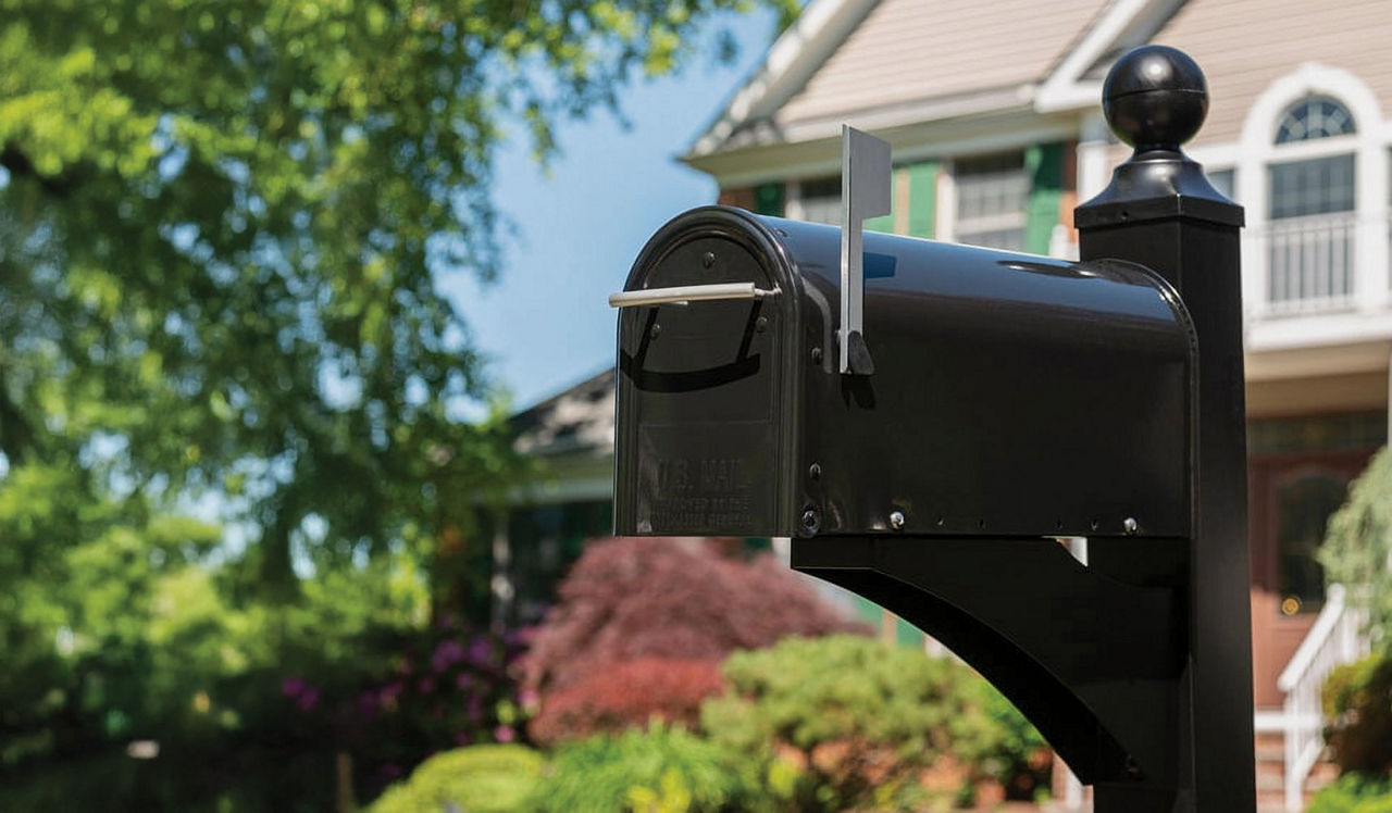 A classic mailbox with the flag up