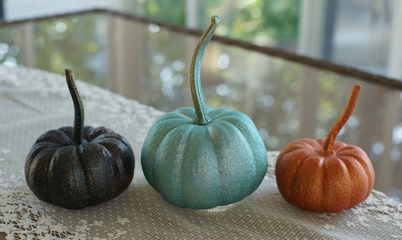 Glitter on the metallic pumpkins with the use of Krylon sealer