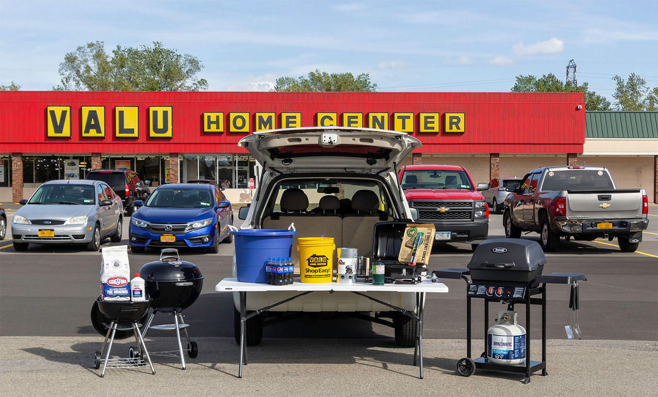 Tailgate set up in front of a Valu Home Center store