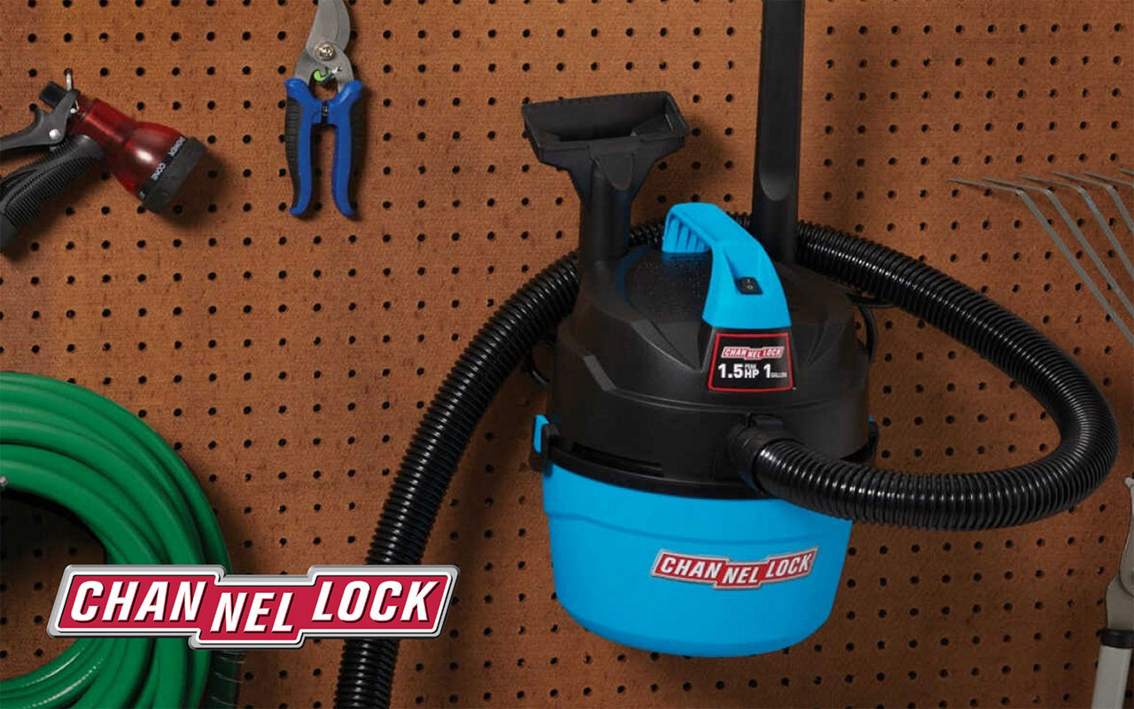 Blue Channel Lock shop vac hanging on the wall next to tools