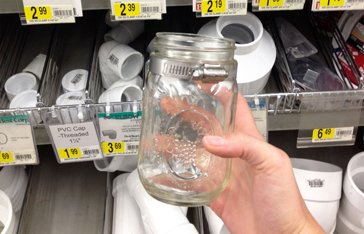 Mason jar in a hand at a hardware store