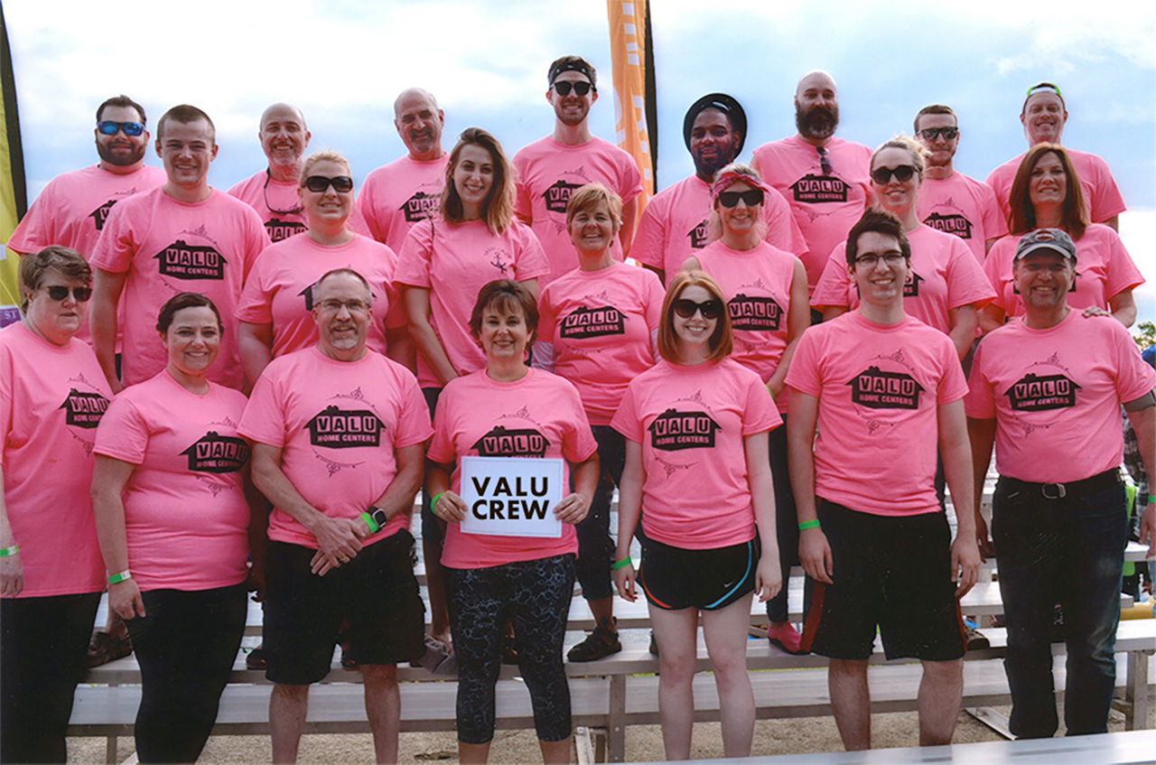 Valu crew group photo with pink shirts