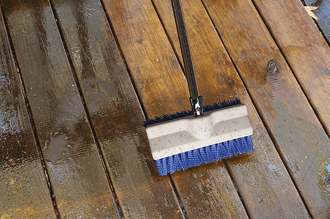 Washin your deck with a mop to prep for redoing your deck