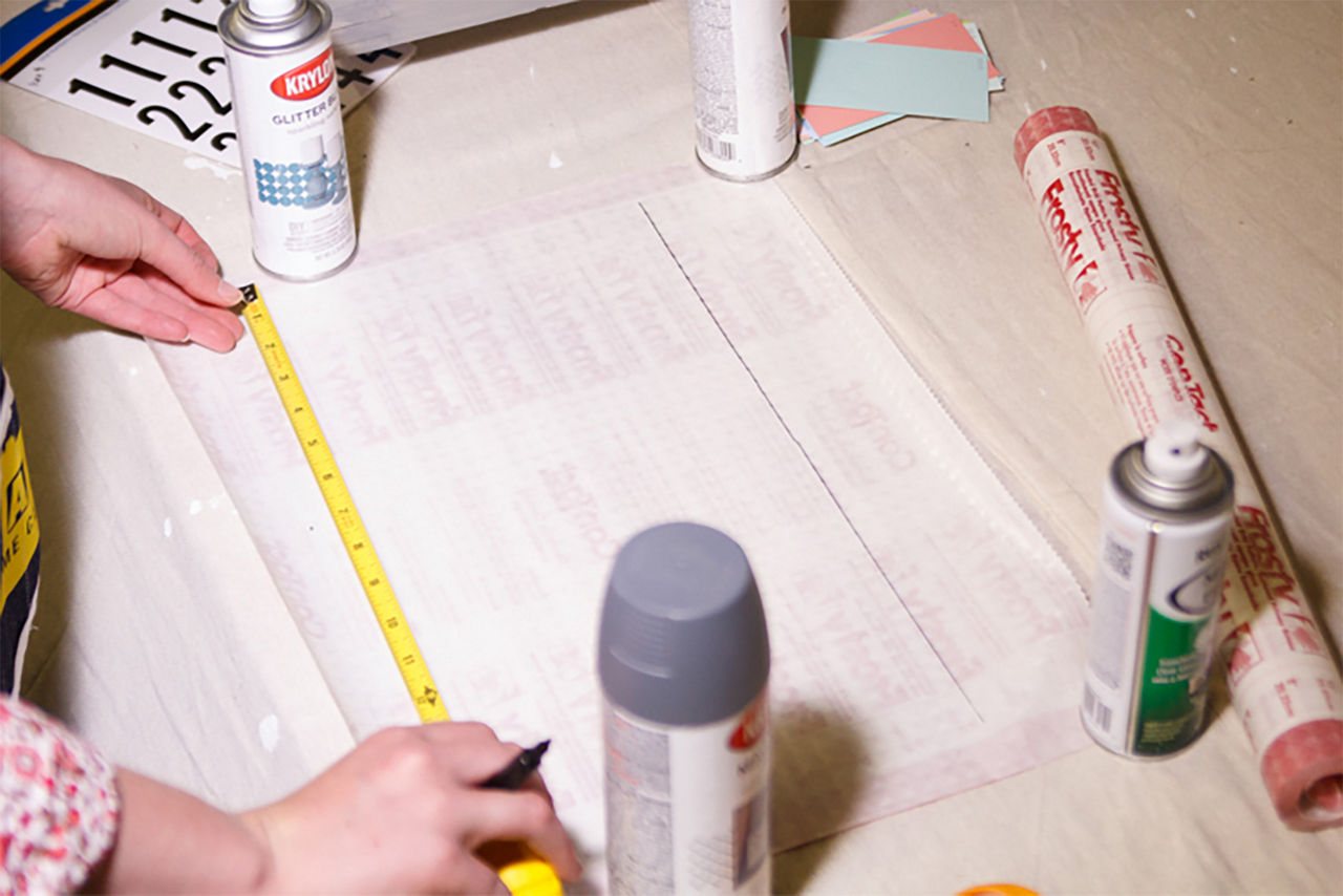 Person measuring inside one quadrant of the window pane