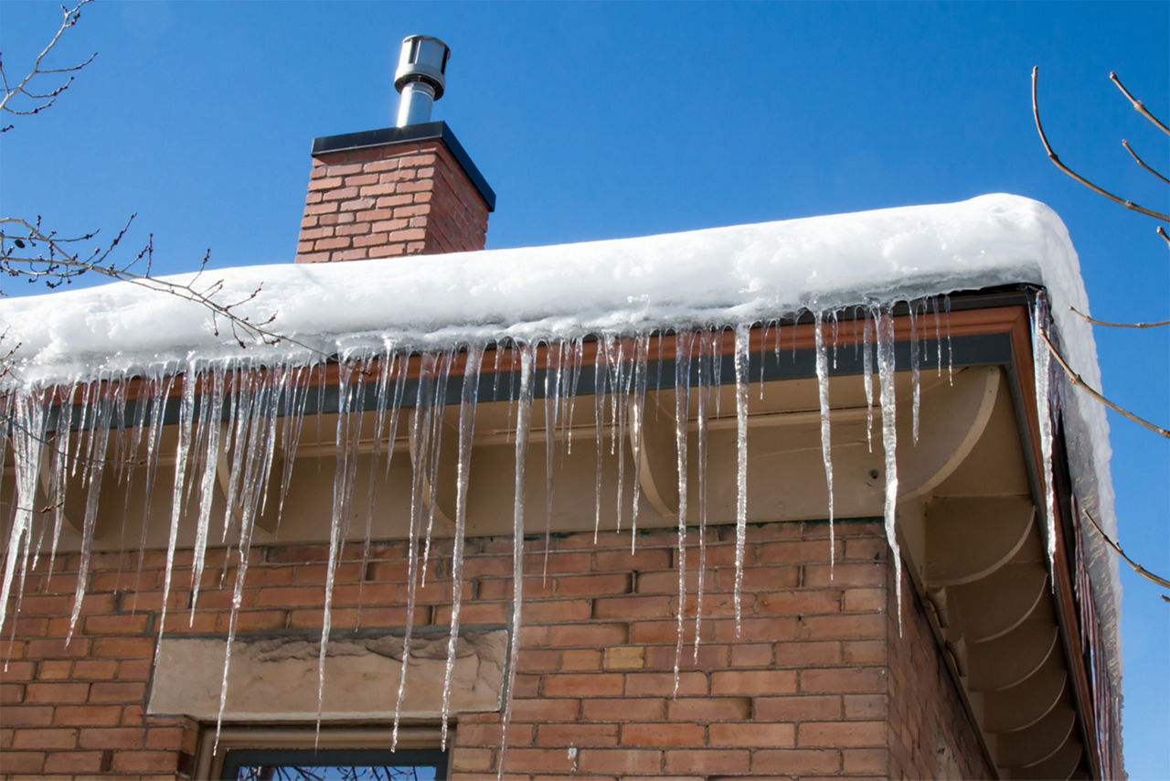 Icicles hanging from a house roof