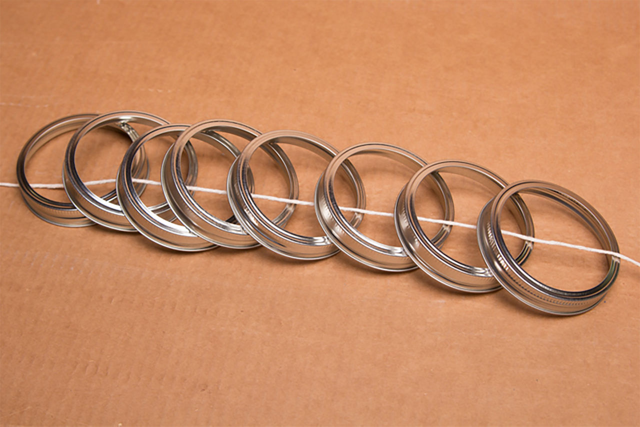 Mason jar lid rings on a string