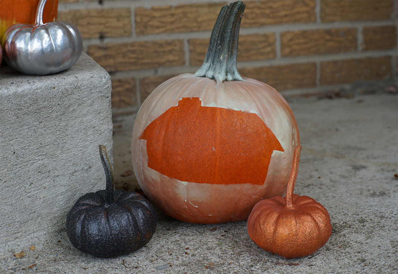 Valu Home Center logo spray painted with glow in the dark on the pumpkin