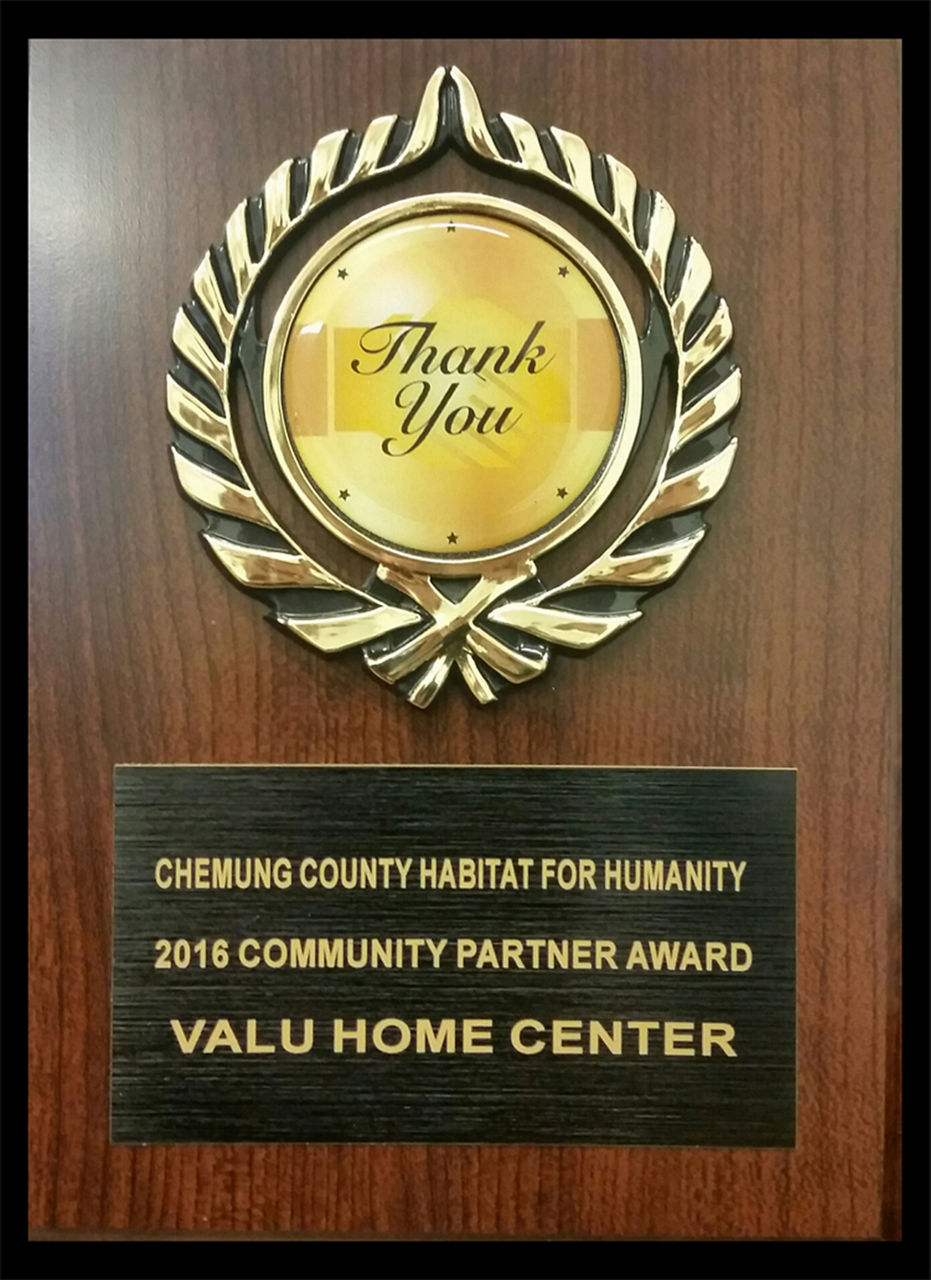 Up close image of hte plaque to Valu Home Center for the Habitat for Humanity Award