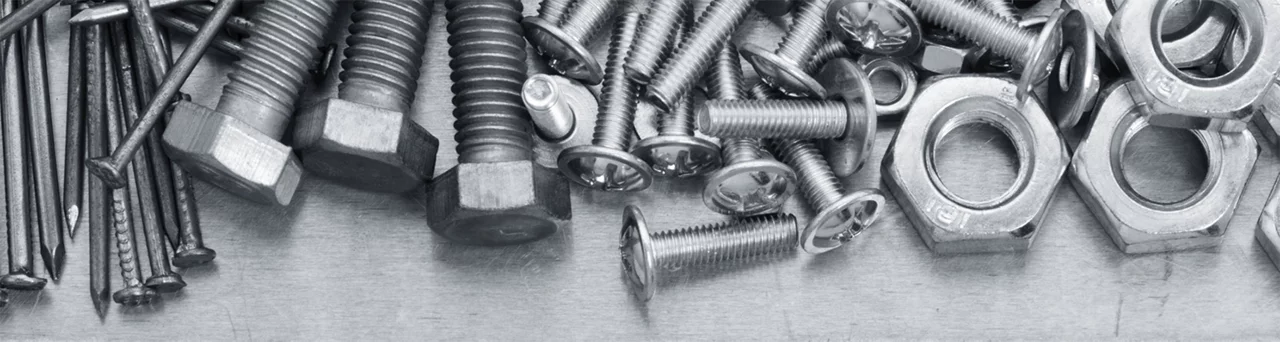 An image of silver nails, bolts, rivets, and nuts