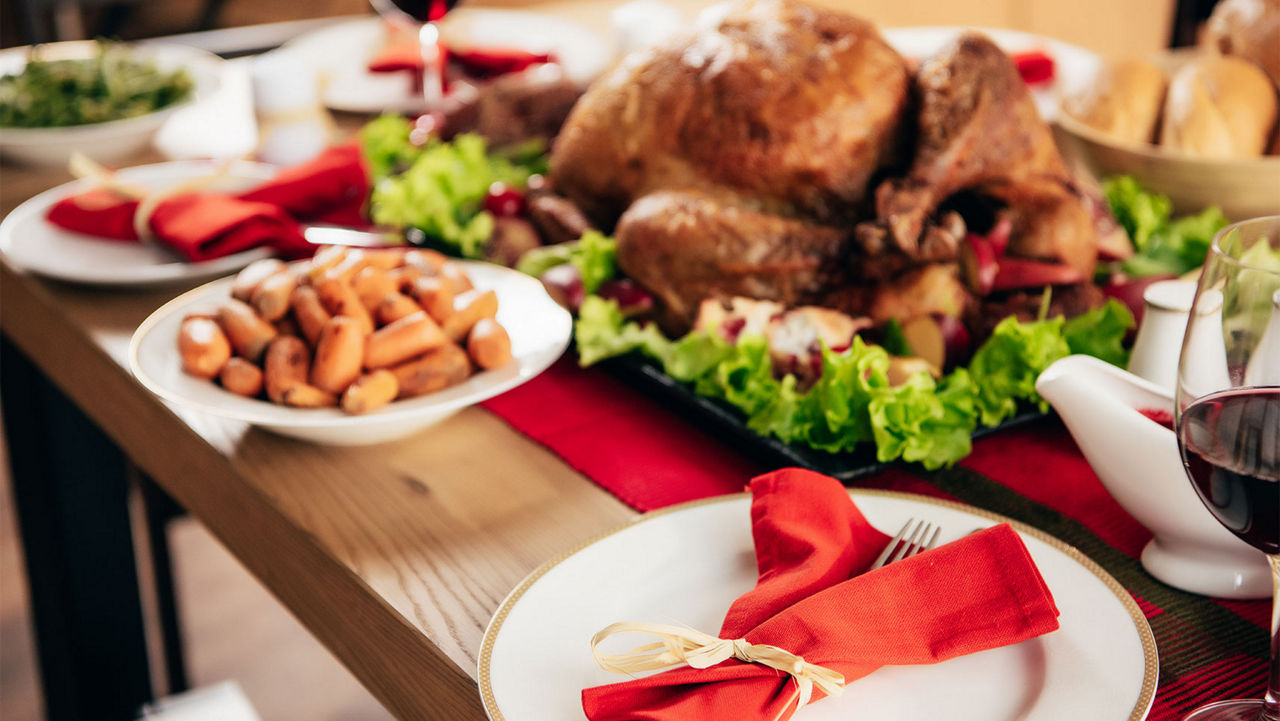 selective focus of served table with wine and delicious dishes for Christmas dinner