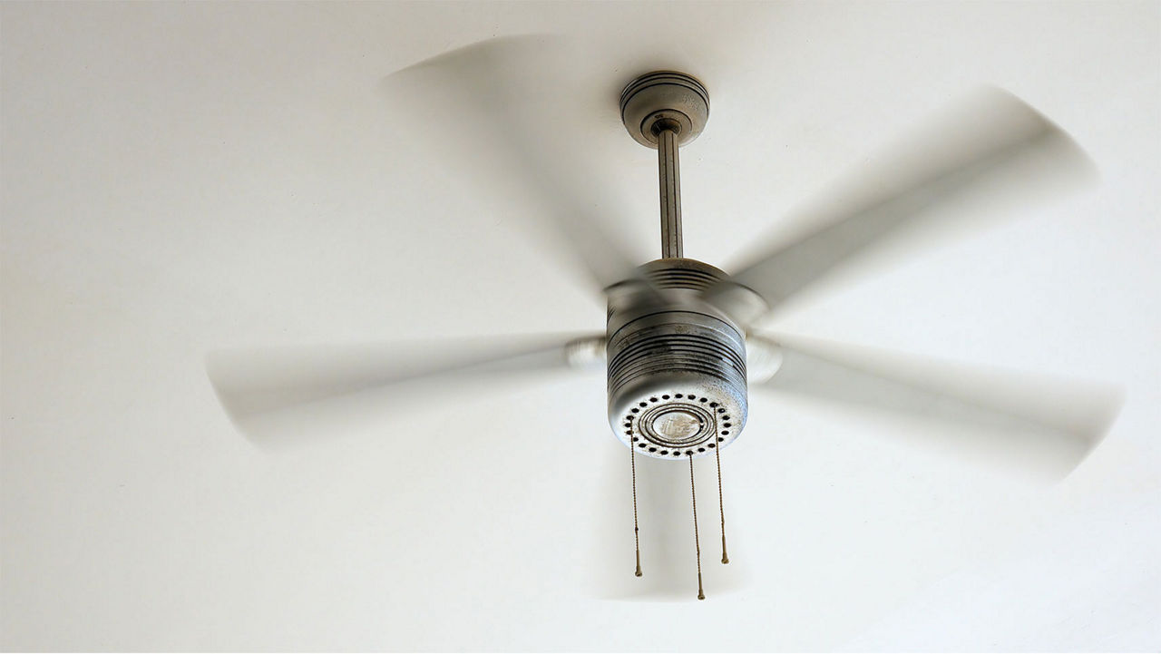 A ceiling fan that is on