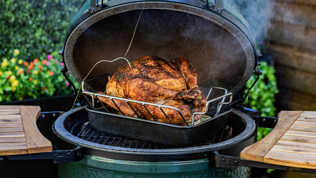 A turkey being cooked on a BIg Green Egg