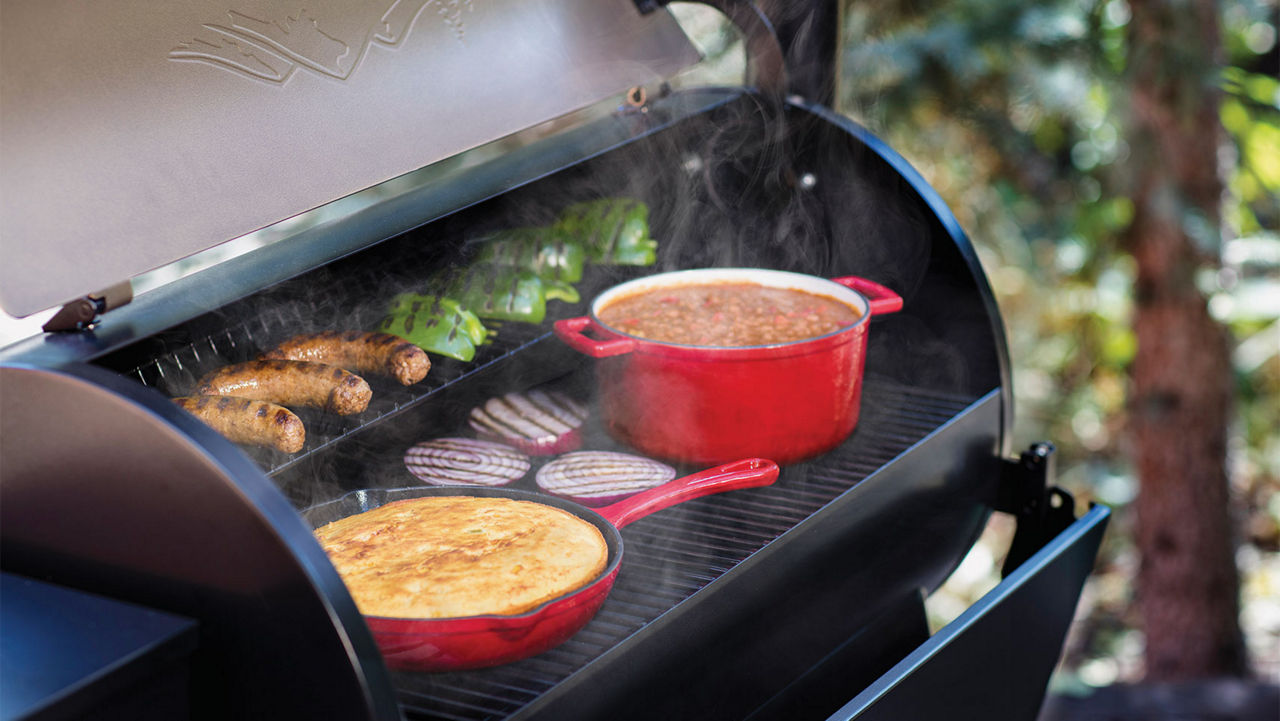 Side dishes being cooked on a grill