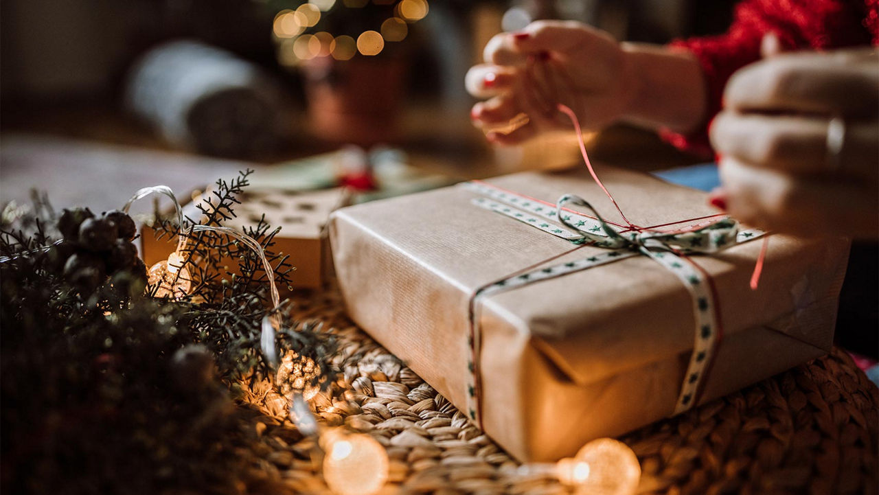 A person wrapping a gift