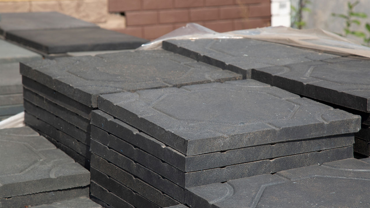 Stack of matte black patio pavers