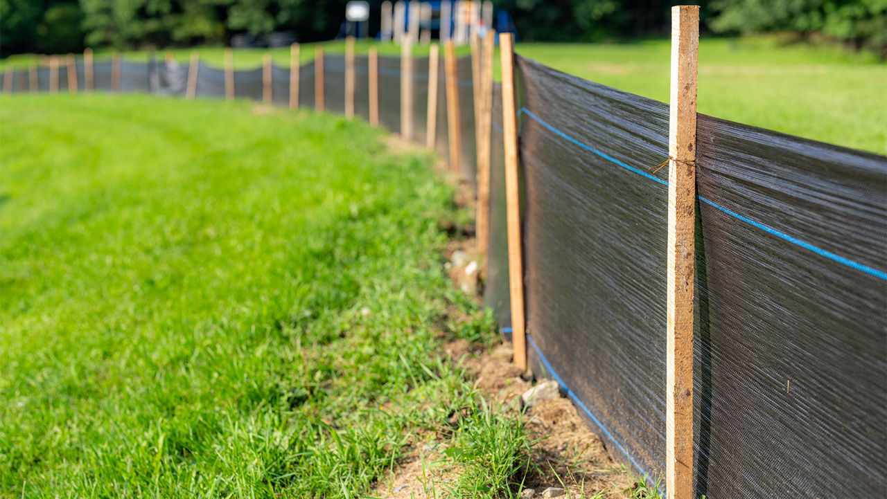Silt Fence fabric with wooden posts installed prior to the start of construction.