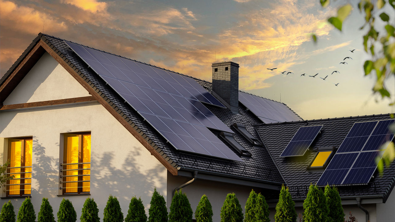 Solar panels on the roof top of a home during sunset