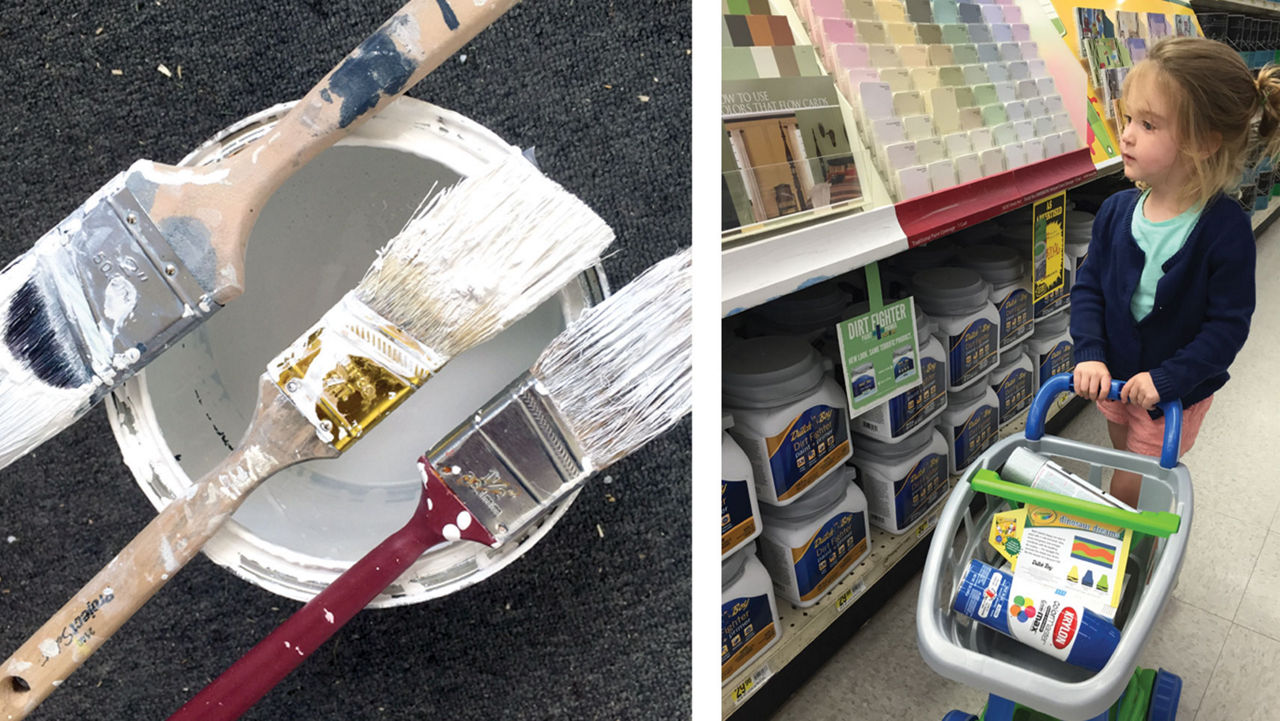 paint brushes on top of a can of paint 