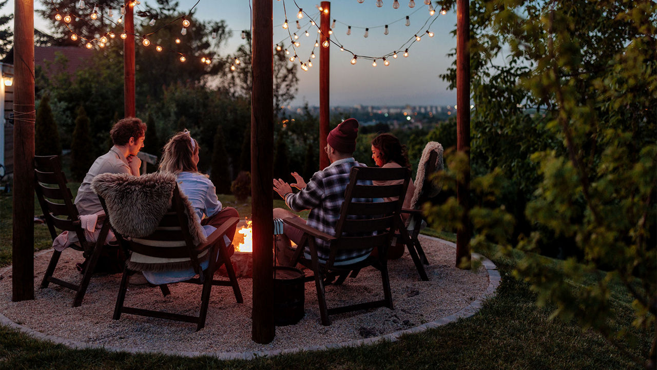 People sitting around a fire pit