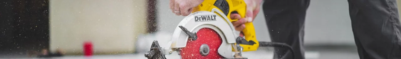 Peron Cutting Wood with a Dewalt Hand Saw