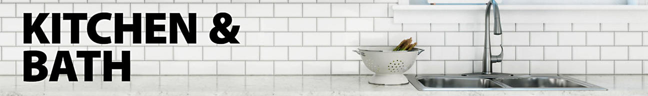 Kitchen and Bath - White subway tiled backsplash with a kitchen sink and faucet
