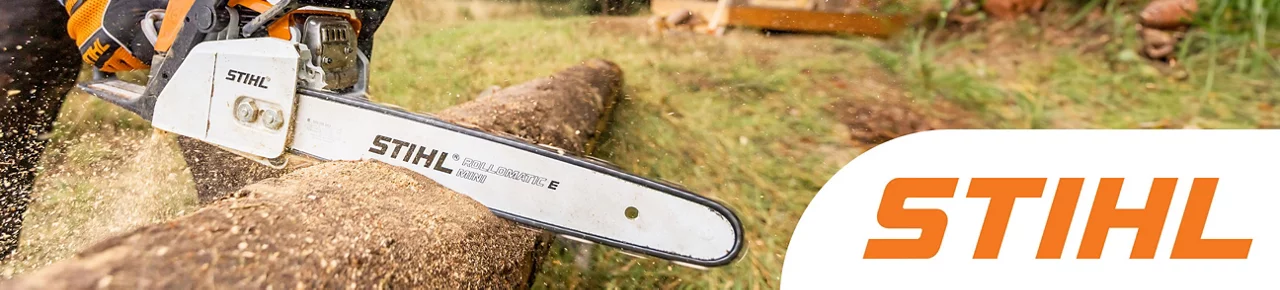 Stihl - Middle aged man using a STIHL gas powered chainsaw to cut down a tree