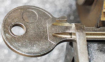 A key being cut on a key cutting machine