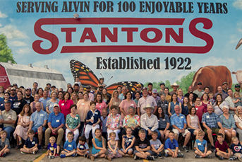 Stanton family in front of building mural