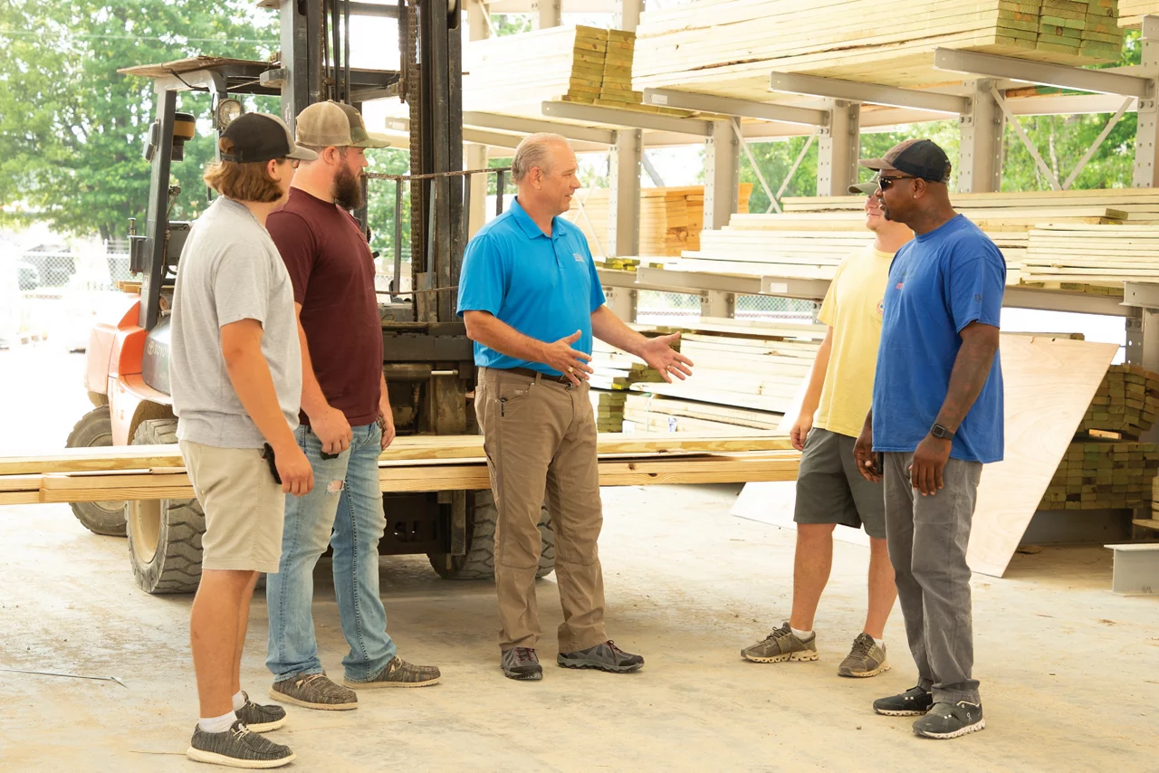 Contractor talking in Nabors lumberyard