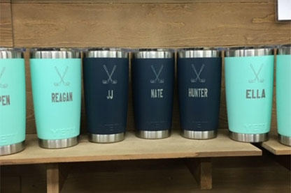 Group of engraved tumblers some navy blue and some teal