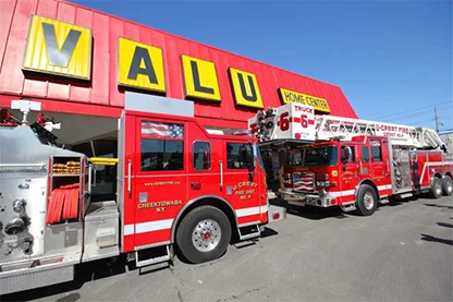 Two firetrucks parked in front of Valu Home Center