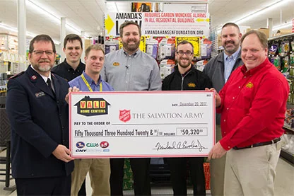 Valu presenting check to The Salvation Army