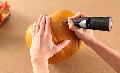 Using a dremmel tool to carve a pumpkin