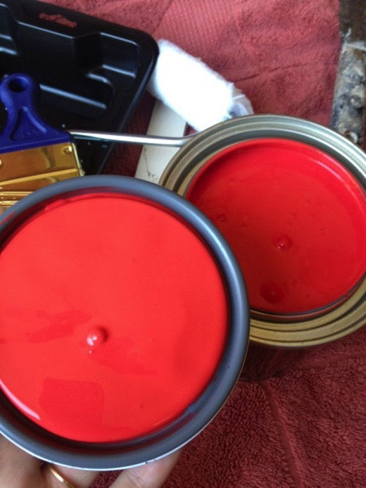 Paint can filled with red paint