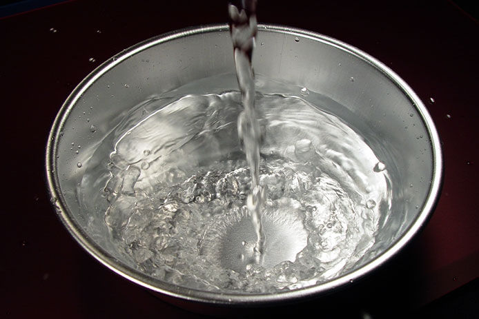 Metal bowl of water