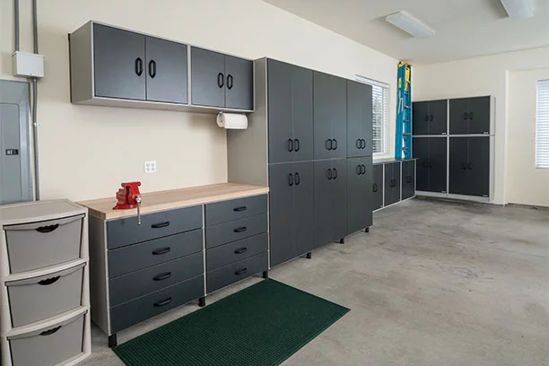 Inside of a garage with various cabinet and storage options