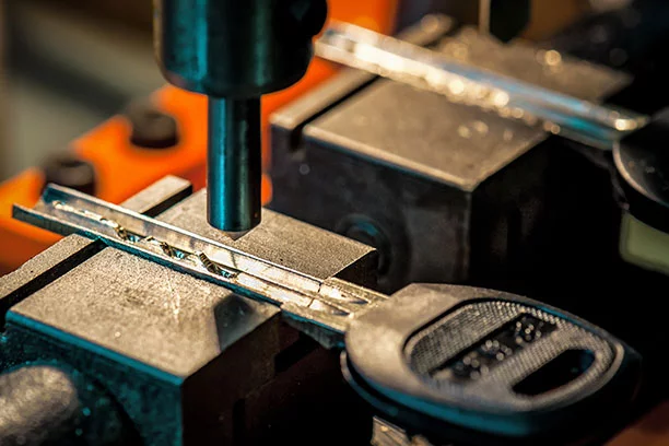 Close-up of a key being cut on the machine