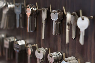 Blank keys hanging on hooks in a hardware store