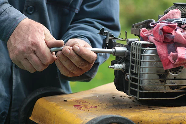 Man working on a small engine