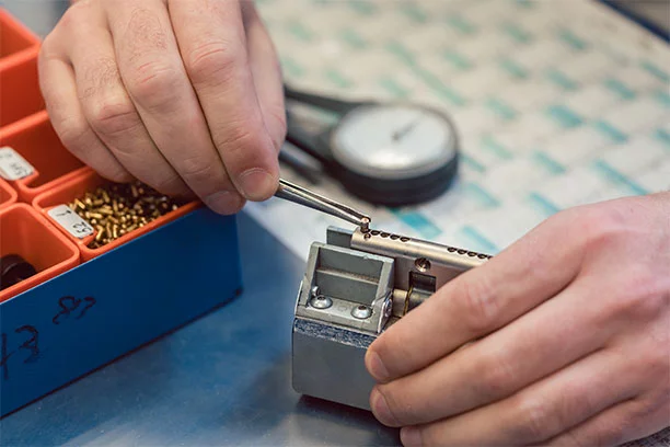 Key cutting machine cutting a car key