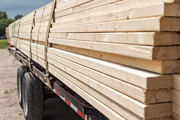Lumber strapped down to a trailer bed