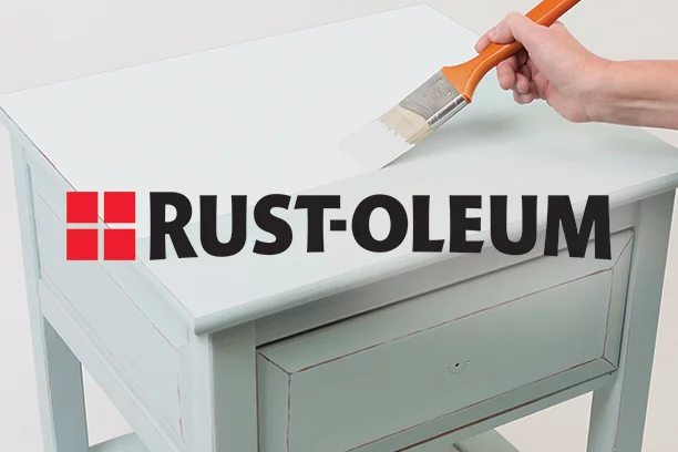 Lifestyle of someone painting a sidetable with the Rust-Oleum logo