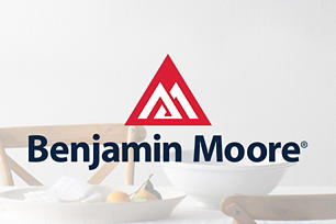 Lifestyle of a table and chair setup with the Benjamin Moore logo